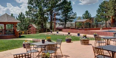 Outdoor patio with a gazebo and seating.