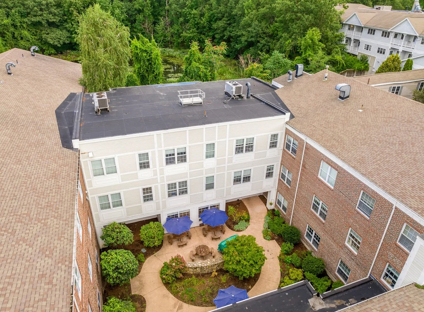  Aerial view facility courtyard with shaded seating.