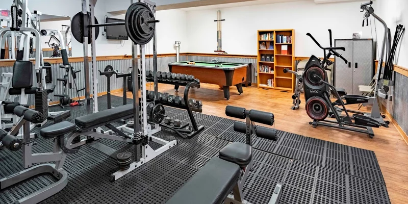 A fully stocked gym with strength training and cardio equipment