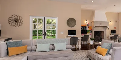 Lounge with seating and fireplace.