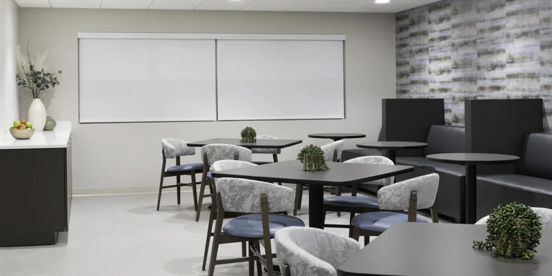 Modern dining room with black tables and gray chairs