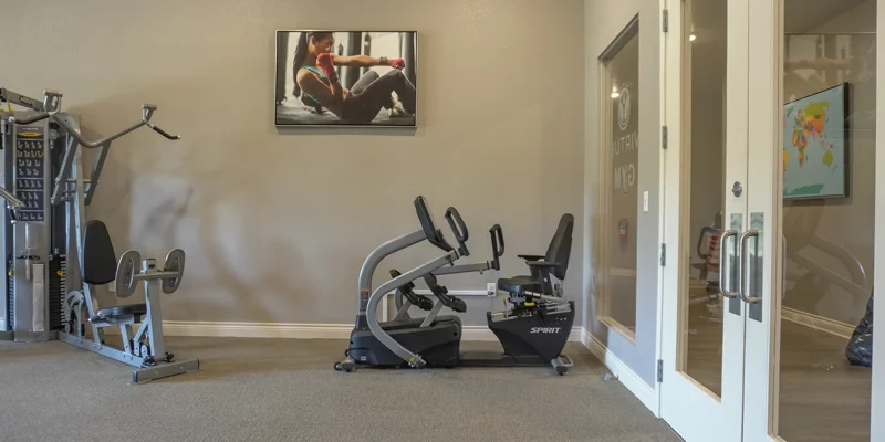 Gym with exercise equipment.