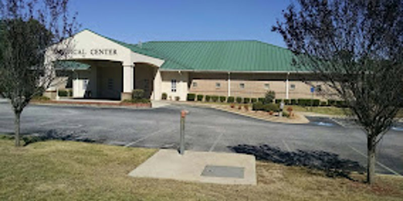 Fcaility exterior with entrance and accessible parking.