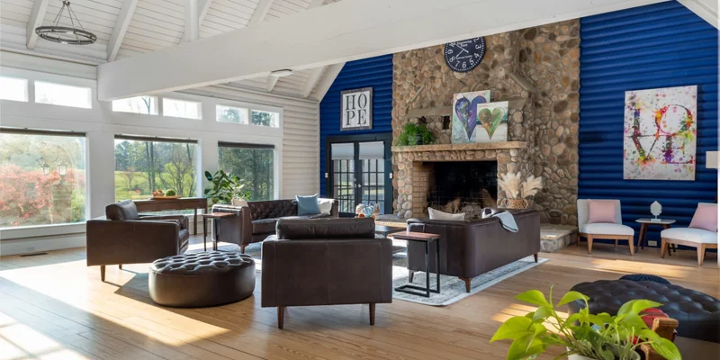 Lounge with seating and a fireplace.