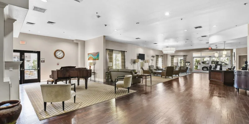 Spacious lobby with a grand piano and seating area