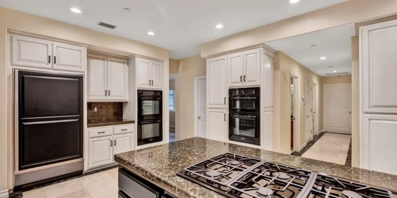 Kitchen with center island stove.