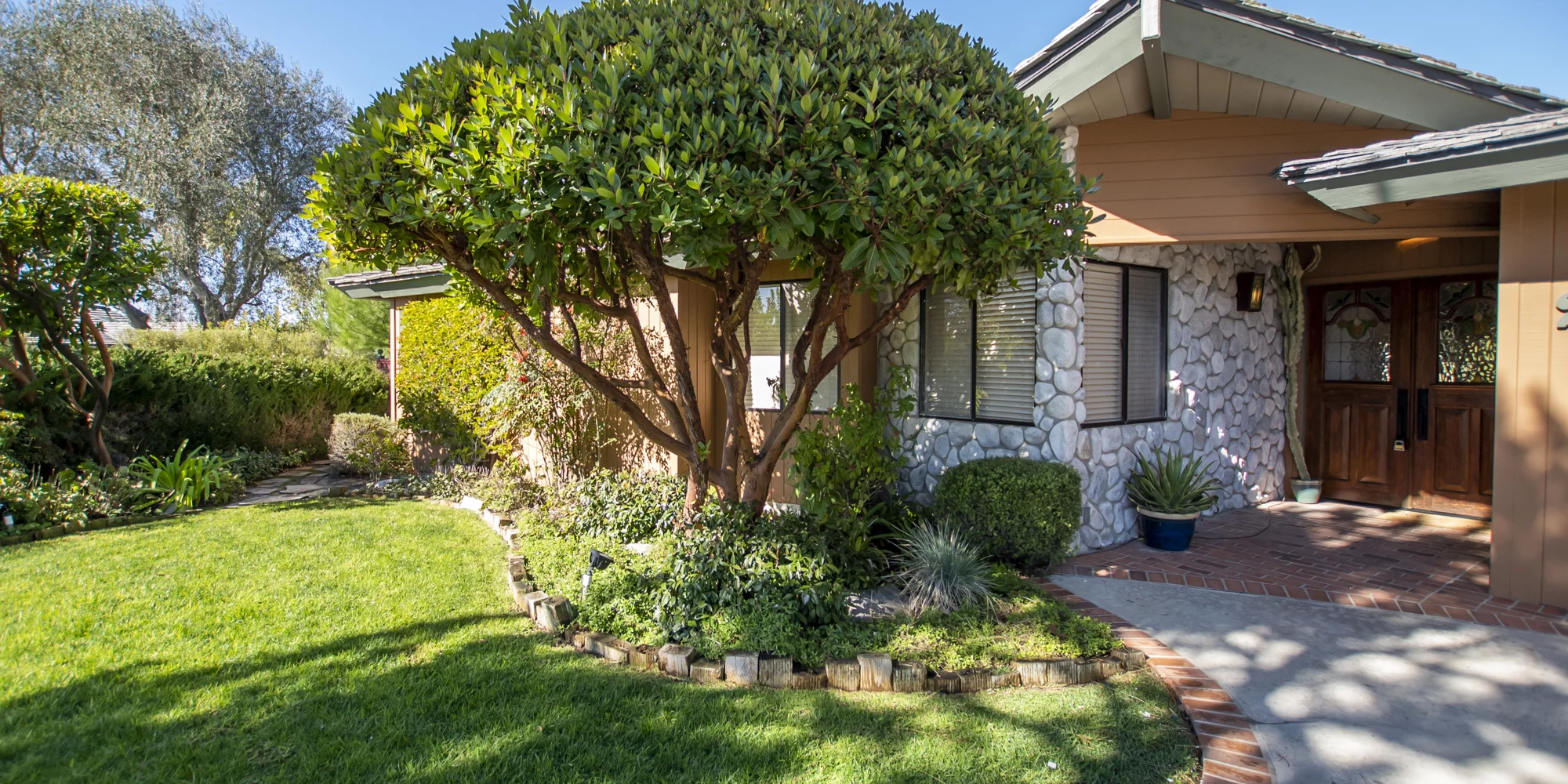 A welcoming rehab facility exterior with lush landscaping.