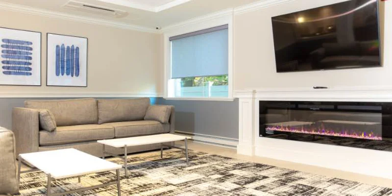 Comfortable lounge area with sofas, coffee table, and TV.