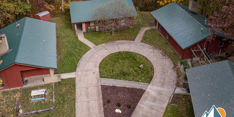 Aerial view of a large rehab center surrounded by a forest