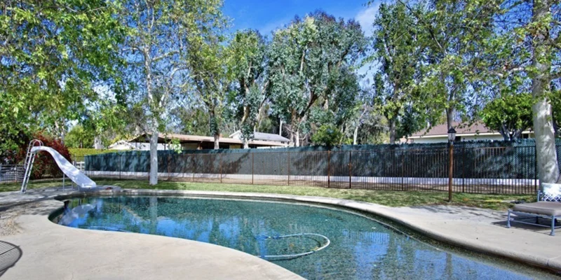 Pool area with slide and seating