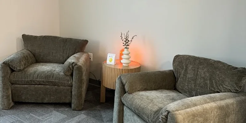 Private counseling space with two large chairs.