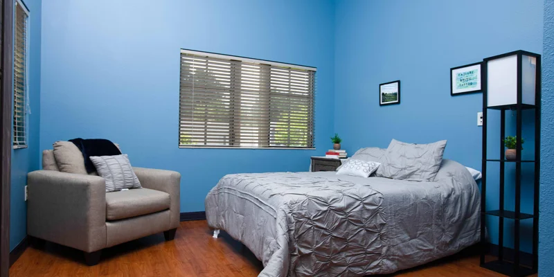 Bedroom with armchair.