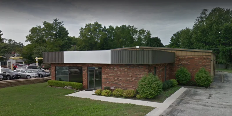 Facility exterior with entrance and accessible parking.