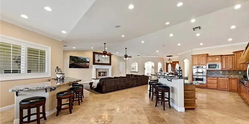 Living area with a fireplace and breakfast bar.