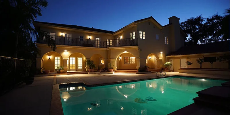 Pool area overlooked by balcony.