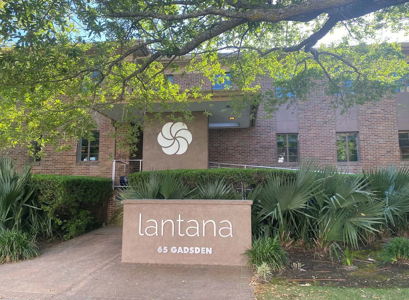 Exterior of Lantana Recovery with brick walls and green landscaping.