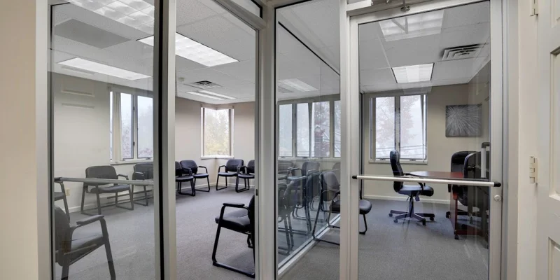 Group therapy room with chairs along the wall.