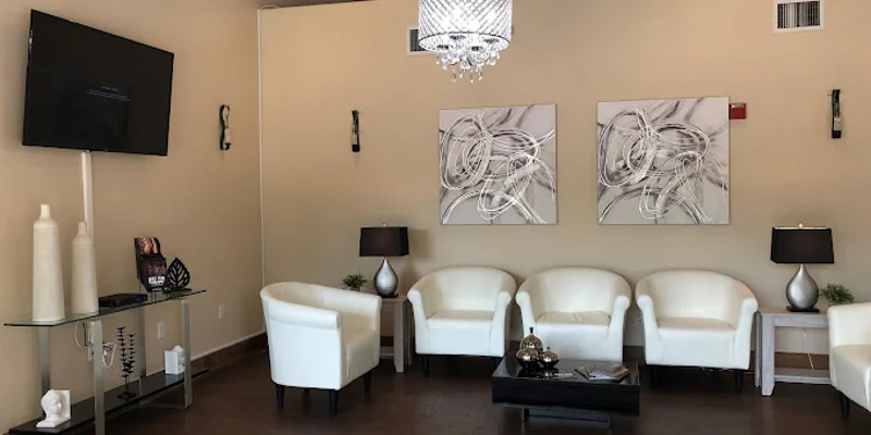 Lounge area with sofas,a TV and a coffee table.
