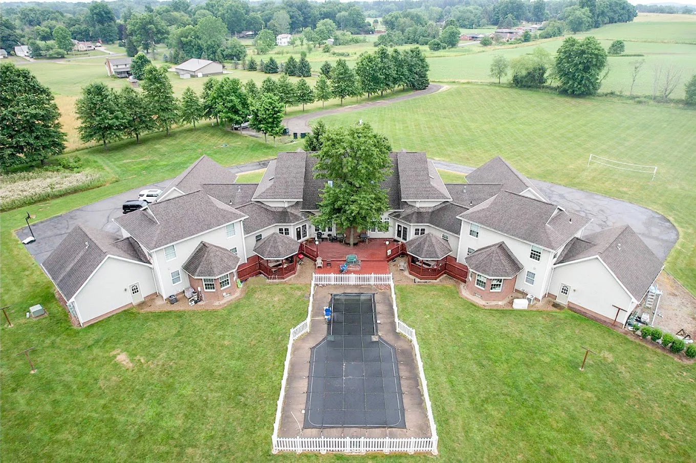 Aerial view of the facility's backyard with a closed-off pool area.