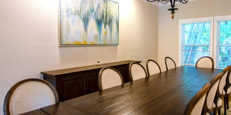 Dining room with a table and chairs.