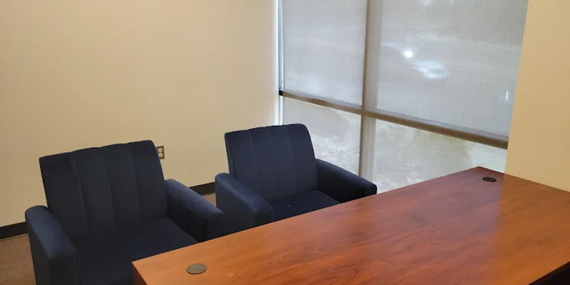 Consultation room with chairs and a table.