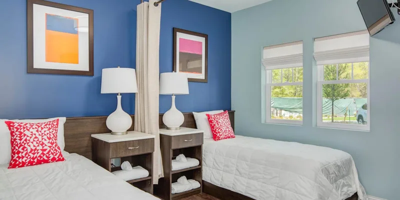 Shared bedroom with two twin beds.