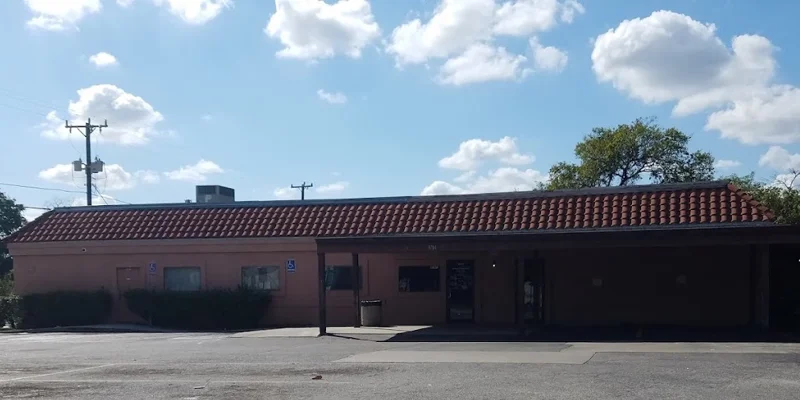 Facility exterior with parking and entrance.