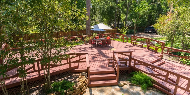 Deck with seating area under shading.
