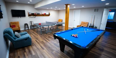 Game room with pool table, ping pong, and lounge seating