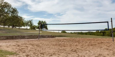 Outdoor sand volleyball court with a scenic landscape view