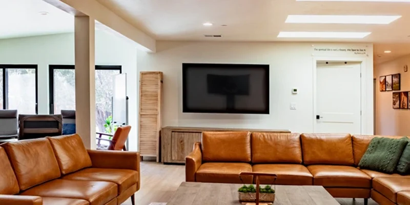 Modern lounge with leather sofas and flat-screen TV