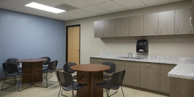 Break room with  tables and seating.