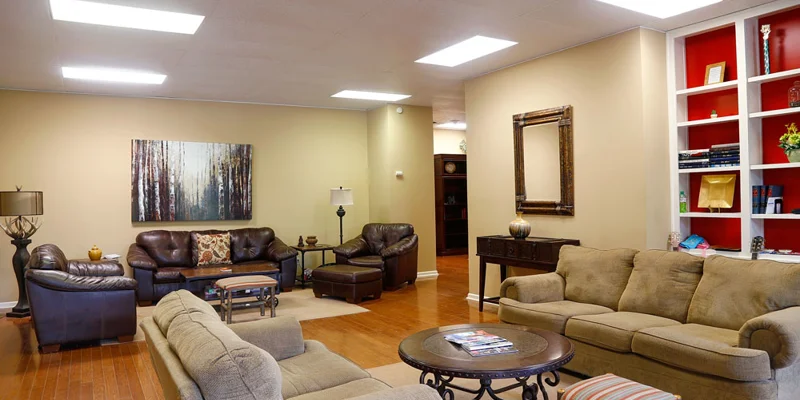 Cozy common area with couches and bookshelves