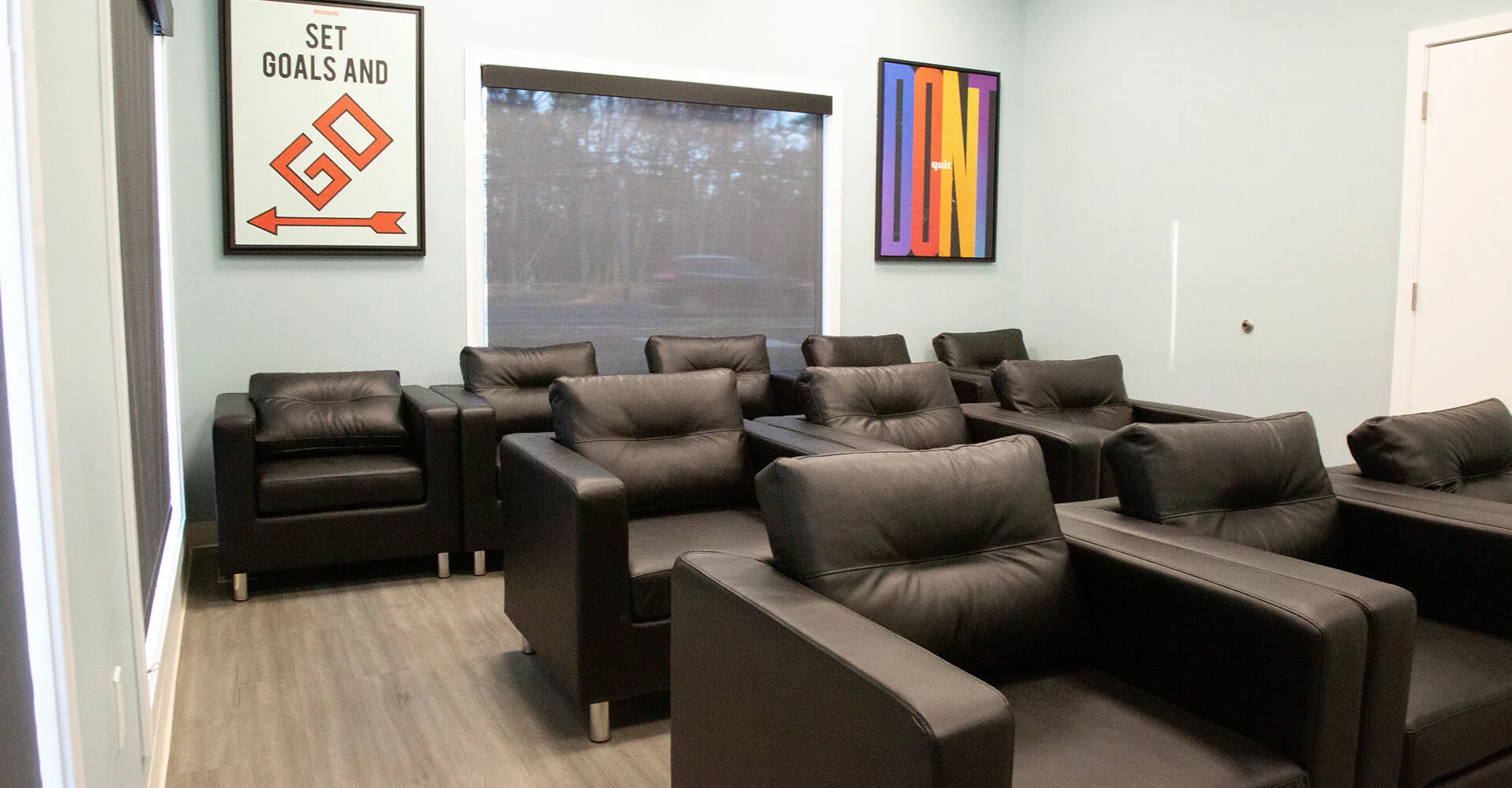 Lounge area with chairs and artwork.