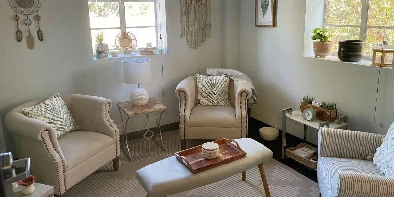 A tranquil therapy space with armchairs and soft lighting