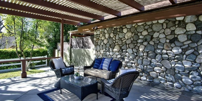 Outdoor seating area under a pergola.