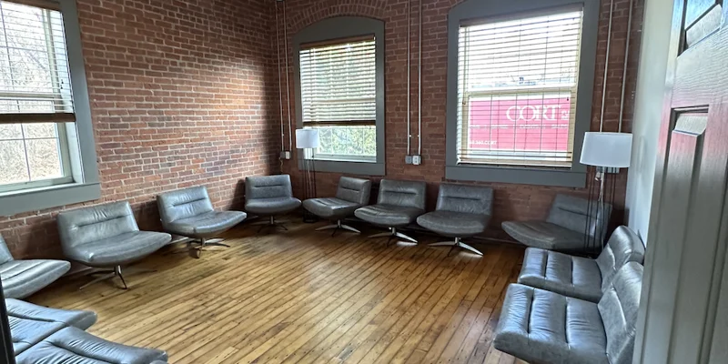 Lounge with gray modern chairs arranged in a circle