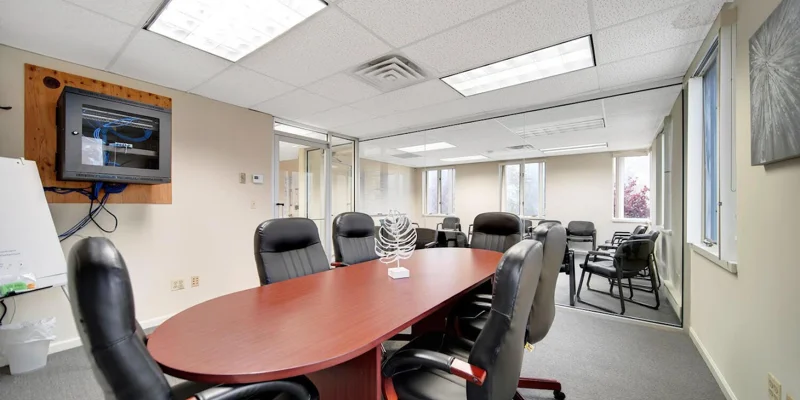 Conference room with a table and chairs.