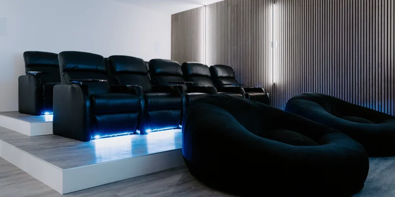 Cinema style area with couches and bean bags in rows