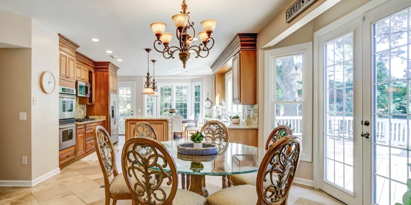  cozy dining area with a round table and French doors leading outside