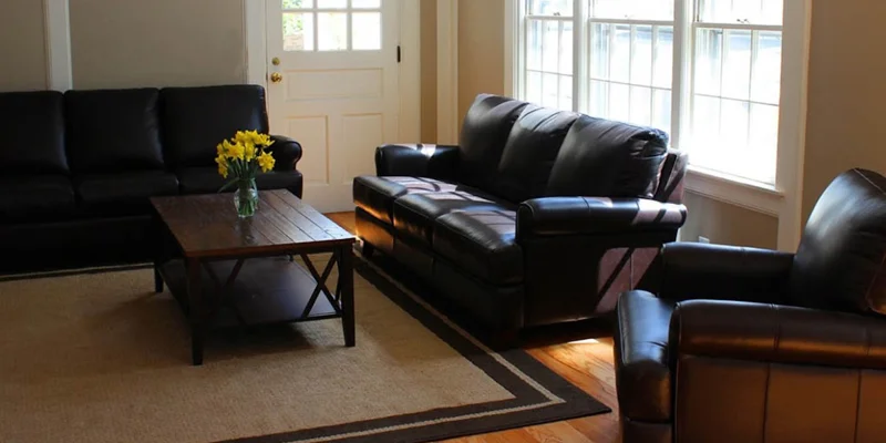 Living room with couches and table.