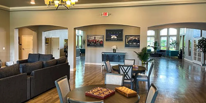 Open lobby area with sofas and tables with games.