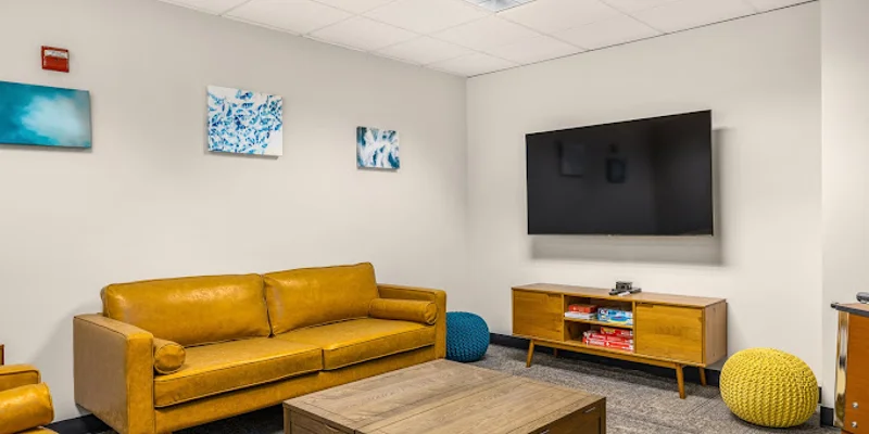 Lounge with a sofas and TV.