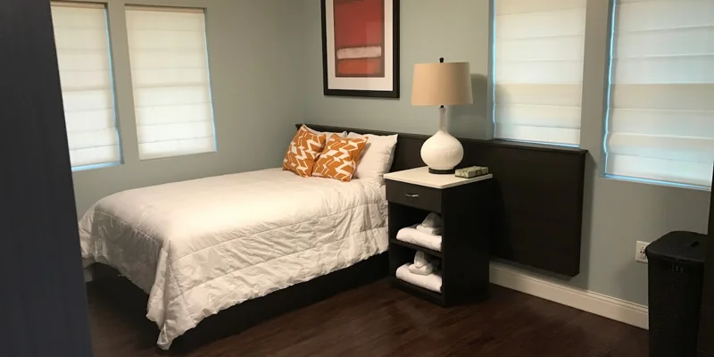Bedroom with a bed and side-table.