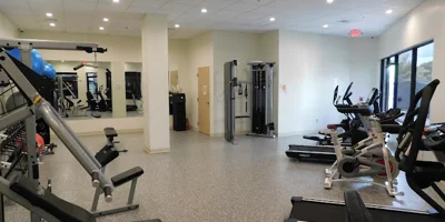 Gym with treadmills and weight machines.
