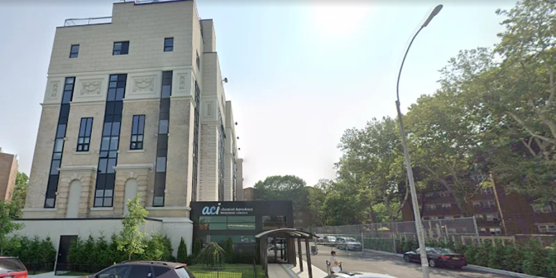 Exterior view of Addiction Care Interventions building and driveway entrance.