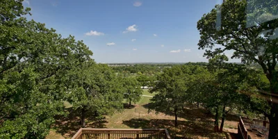 Elevated deck overlooking a lush green landscape