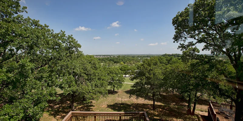 Elevated deck overlooking a lush green landscape