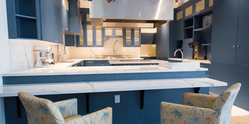 Spacious kitchen with modern appliances and marble countertops.