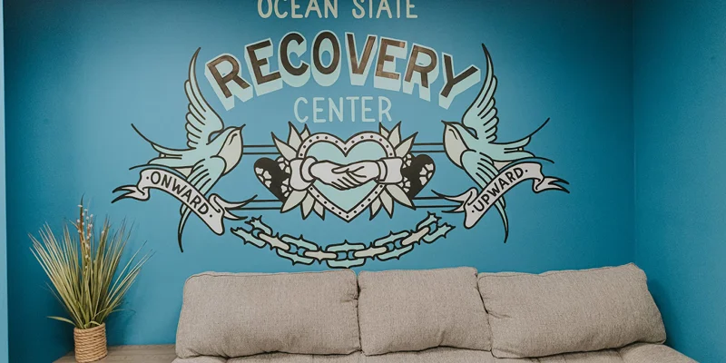 Waiting area atOcean State Recovery Center with a sofa.